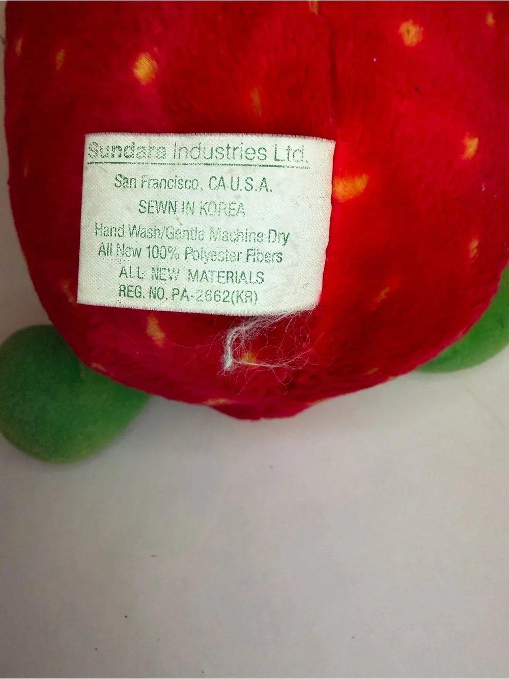 Cute Red Strawberry Plush Toy with Green Leaf Accents